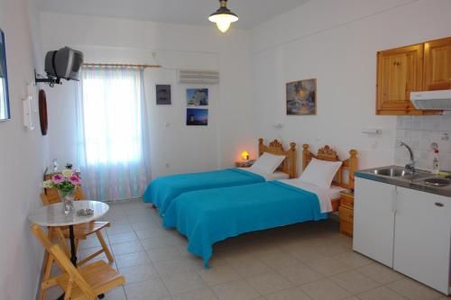 Η κουζίνα ή μικρή κουζίνα στο Karabo Hotel