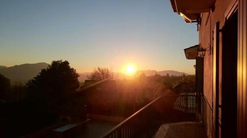 a sunset seen from a balcony of a building at B&B Verde Irpinia in Gesualdo