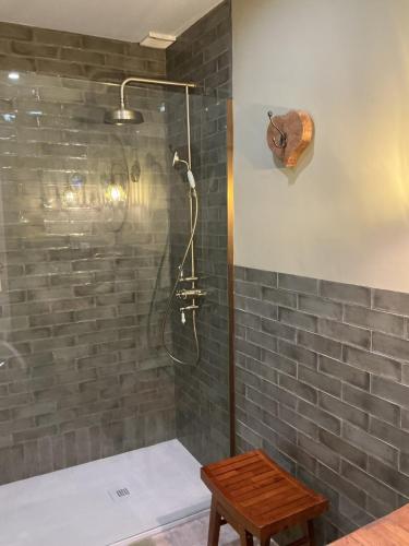 a bathroom with a shower with gray tiles at Apartment Duquesa Fairways/Manilva, Spain in Manilva