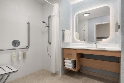 a bathroom with a sink and a mirror at Homewood Suites by Hilton Burlington in Burlington