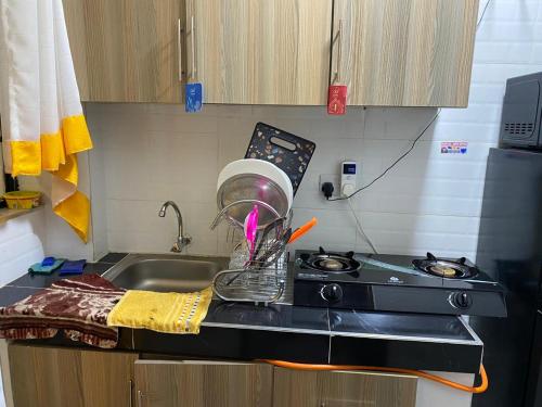 a kitchen counter with a sink and a mixer at RENE haven in Nairobi