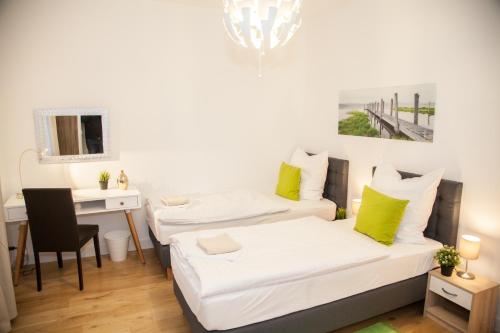 Ένα ή περισσότερα κρεβάτια σε δωμάτιο στο Apartment Haus Heidelberg
