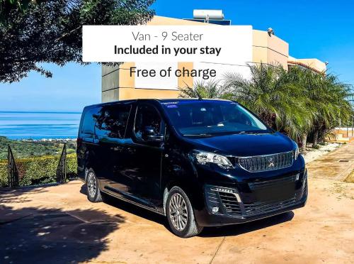 a black van parked in front of a building at Villa Ariella With Sea View in Agia Marina Nea Kydonias