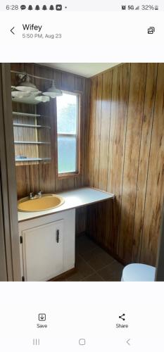 a bathroom with a sink and a counter top at Mem's Place in Bluefield
