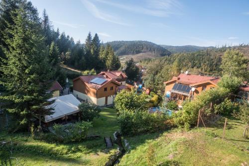 an aerial view of a house in the mountains at Penzión Pod Guglom in Mlynky 