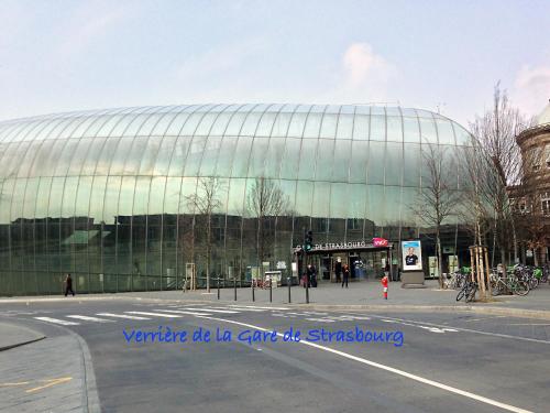 a large glass building on the side of a street at La Cour des Amis in Vendenheim