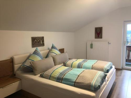 two beds sitting on a couch in a room at Ferienhaus Kollmer in Bad Koetzting