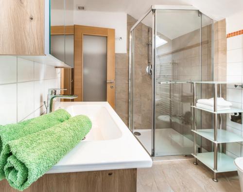 a bathroom with a sink and a shower at Bambichl Hoamat in Fuschl am See