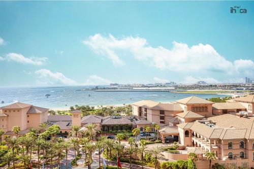 an aerial view of a resort with the ocean at 1 Br Boho Beach Ain Full Sea View JBR 1 min in Dubai