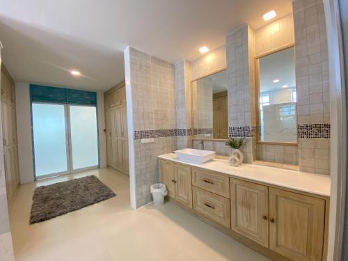 a bathroom with a sink and a mirror at Baan Ban Dalay in Ao Nang Beach