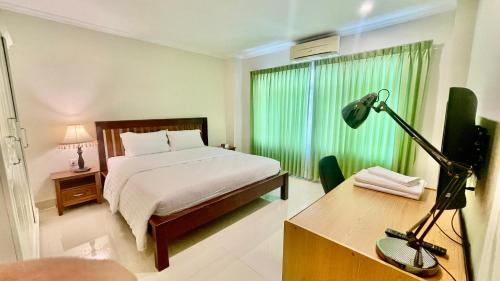 Llit o llits en una habitació de Royal PSL