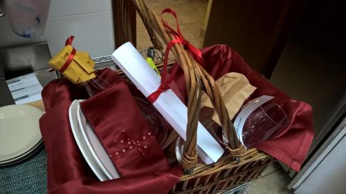a basket filled with books and red napkins at B&B Casa Mila' in Pretoro