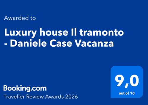 a blue sign with the words luxury house il tramontoampire case vazaaza at Luxury house Il tramonto - Daniele Case Vacanza in Anzio