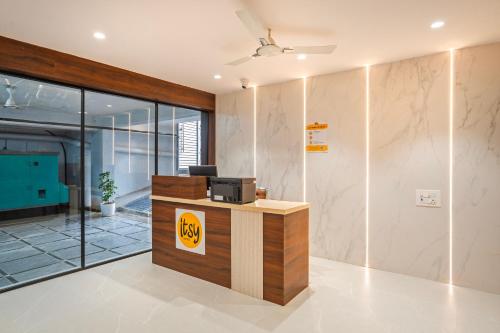 an office with a desk with a pay phone at Itsy Hotels Saffron Groves in Hyderabad