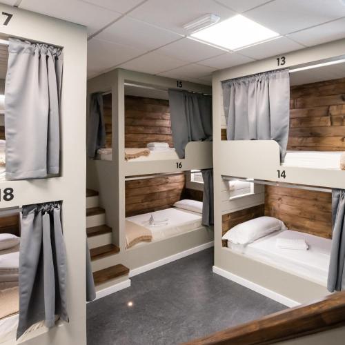 a room with multiple bunk beds in it at Albergue As Pozas Termais in Caldas de Reis