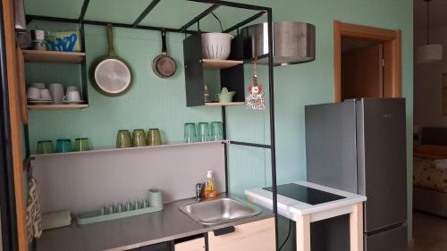a small kitchen with a sink and a refrigerator at ARISTOCASA in Lecce