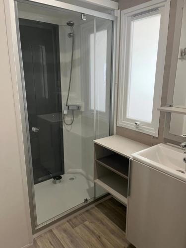 a bathroom with a shower and a sink at Camping 3 étoiles - Piscine - ccbfa0c in Saint-Mandé-sur-Brédoire