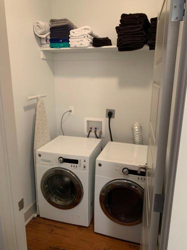 a laundry room with a washer and dryer at Creole Nest 2 in New Orleans