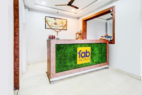 a television screen in a room with aoit motives sign on it at FabHotel P2 And Resort in Bhopal