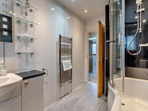 a bathroom with a shower and a sink and a toilet at 2 Bed in Killin oc-pe512 in Killin