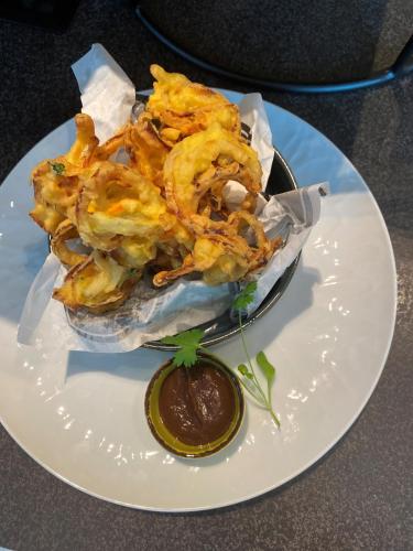 a plate with a bowl of food on a table at Four Points by Sheraton Budapest Danube in Budapest