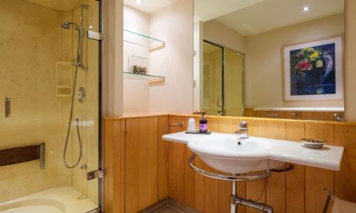 a bathroom with a sink and a shower at Underscar - Luxury 2 Bed Apartment in Keswick