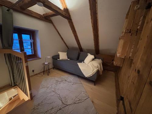 an overhead view of a living room with a couch at Stöckli Gantrisch-Blick in Rüeggisberg