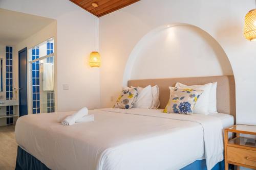 Hotel Solar do Arco tesisinde bir odada yatak veya yataklar