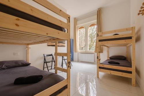 a bedroom with two bunk beds in a room at A Casa Gualandi in Bologna