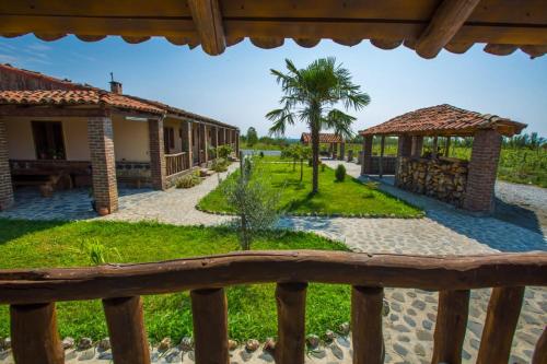 a view from the porch of a house with a garden at Gugoshvili's Cellar in Kvareli