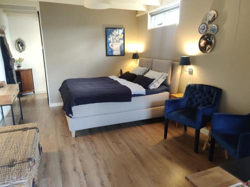 En eller flere senge i et værelse på B&B Hoofddorp