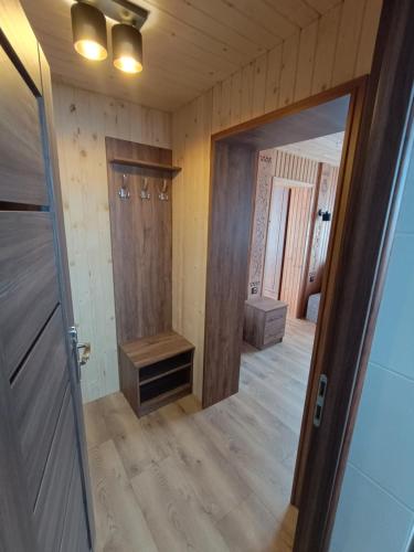 a room with a hallway with a door and a mirror at Felągówka in Murzasichle