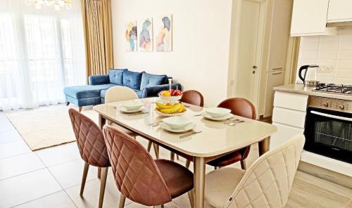 a kitchen and living room with a table with a cake on it at Thalassa Beach Resort - 107 in Vokolidha
