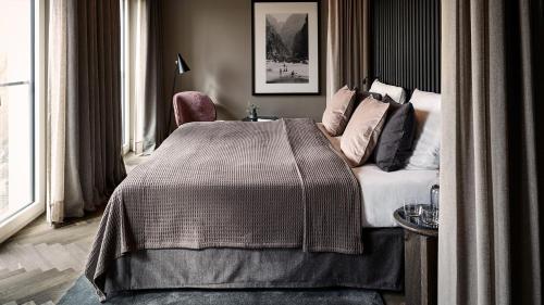 Una cama o camas en una habitación de Mauritzhof Hotel Münster