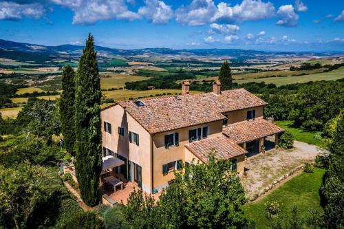an aerial view of a large house with trees at Villa Beltramonto by MMega in Castiglioncello del Trinoro