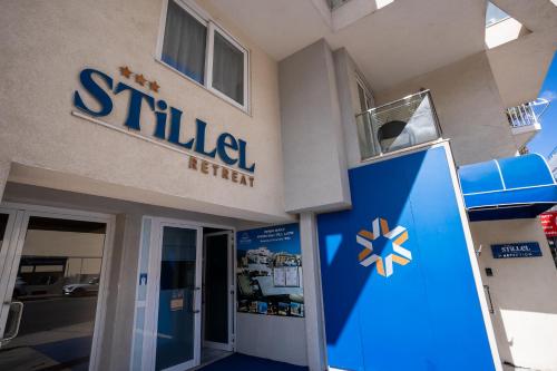 a building with a sign for a sulfeder insurer at Stillel SkyLounge Suites in St. Paul's Bay
