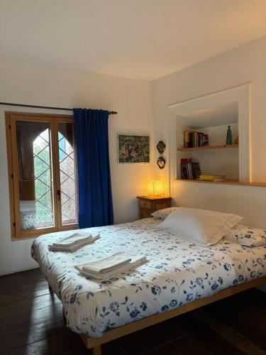 a bedroom with a bed with towels on it at Bed & Breakfast Villa Buzzati in Belluno