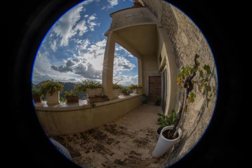 a circular view of a balcony with potted plants at Palazzo Tronconi agriturismo in Arce