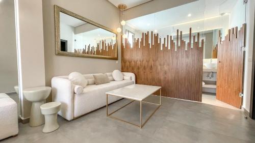 a living room with a couch and a mirror at Beautiful Asma Villa with pool in Marrakesh