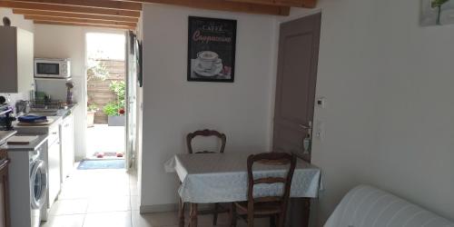 Maisonnette avec terrasse et place de parking