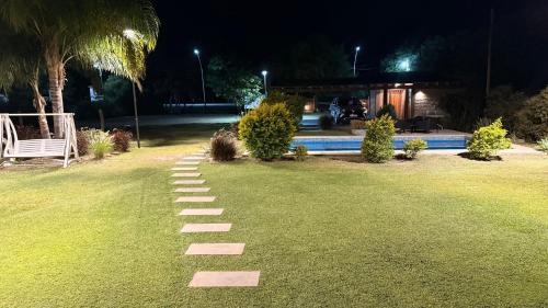 a stepping stone path in a yard at night at Casa Ruta 1 in San José