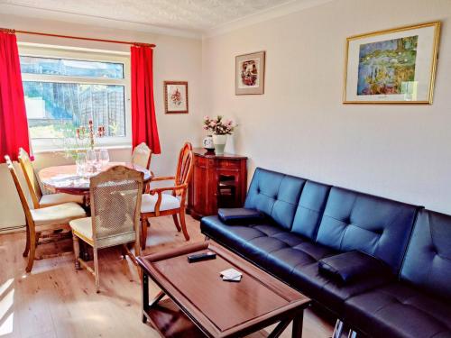 a living room with a couch and a table at Sherlock's House --Melbourne 4 BR sleep 9 Privat parking x 3 vans Super WiFi Enclose rear garden Contractors Family with children Relocators Long stay Dogs welcome Close to Alton tower Twycross Zoo in Burton upon Trent