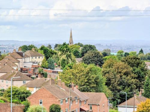 a view of a town with houses and a church at Sherlock's House --Melbourne 4 BR sleep 9 Privat parking x 3 vans Super WiFi Enclose rear garden Contractors Family with children Relocators Long stay Dogs welcome Close to Alton tower Twycross Zoo in Burton upon Trent