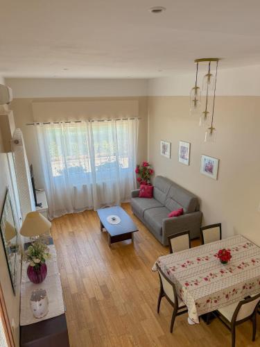 a living room with a couch and a table at Gite Mireille in Carros