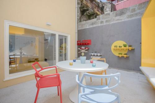 a dining room with a table and two chairs at Liiiving in Porto - Clérigos Terrace Apartment in Porto