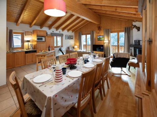 a dining room and kitchen with a table and chairs at Chalet Ropiar by Interhome in Ovronnaz