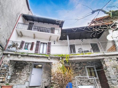 an apartment building with a balcony on the side of it at Holiday Home Iside by Interhome in Mergozzo