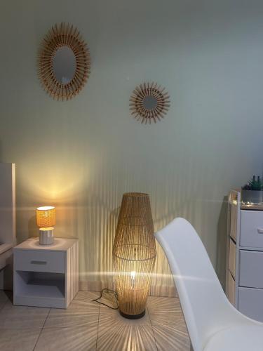 a room with two mirrors and a lamp and a slide at nid douillet in La Roche-Posay