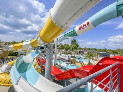 a roller coaster ride at a water park at ZEcamping familial dog friendly familial parc aquatique in Olonne-sur-Mer