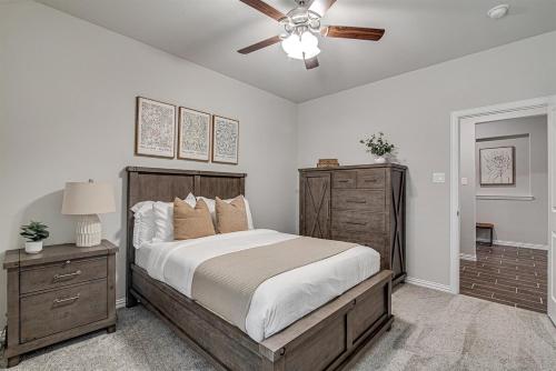 a bedroom with a bed and a ceiling fan at Where Comfort Meets Convenience in Burleson